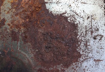 Rusty steel plate or damage metal for backgrounds and textures design closeup.