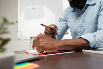 Teacher. Online english courses at home. Close up hands of man during teaching students remotely in...