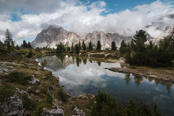 Fototapeta na wymiar Morning foggy view of lago di limides in Dolomties, famous destination in south Tyrol, Italy