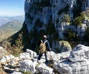 Hiker at summit of alburni massif in Cilento National Park on Apennines