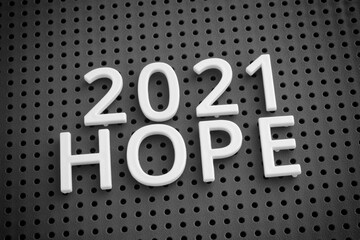 The year 2021 and the word hope. Black and white.