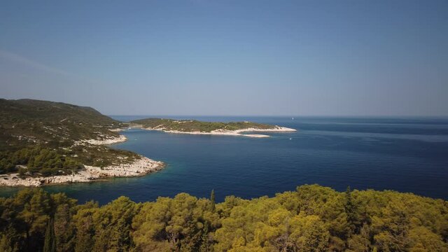 Panning view of beaches near Vis on the island of Vis in Croatia and small islands beyond