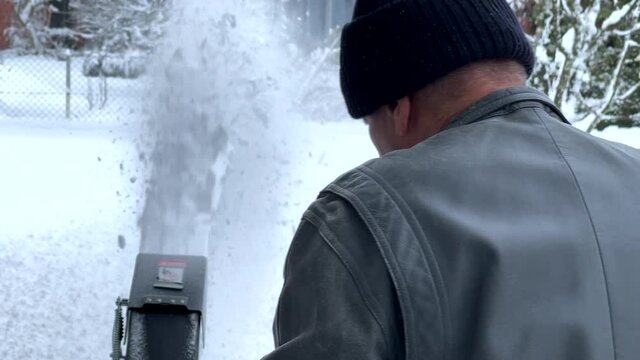 Man using a snow blower 