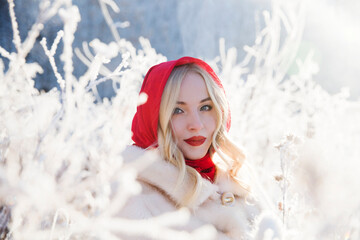 beautiful young woman smiles and laughs on a winter walk