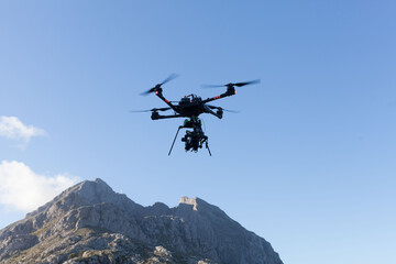 Professional cinematographic drom with video camera filming the Tramuntana mountains on the road to Sa calobra