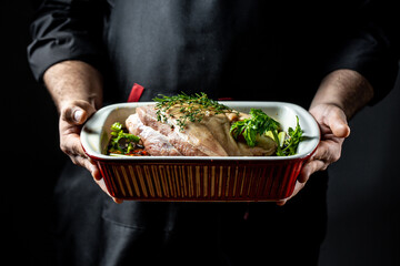 Professional cook prepares Roasted pork knuckle eisbein. German cuisine, banner, menu, recipe, place for text