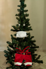 Christmas tree with face mask. Christmas decoration. Coronavirus pandemic Covit-19.