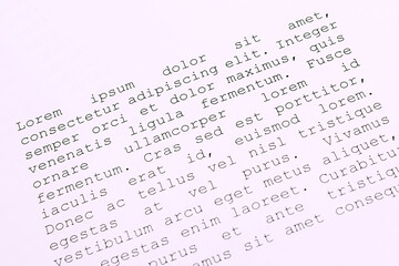 lorem ipsum dolor sit amet concept. selective focus photo of paper sheets with publishing and graphic design placeholder text on them.