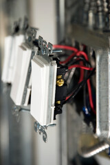 Electrical wall switches installation close-up