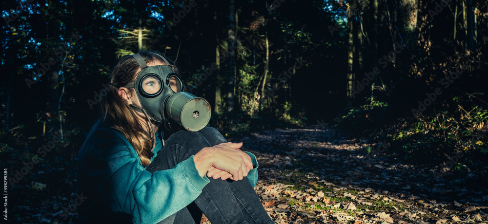 Wall mural girl with gas mask in forest