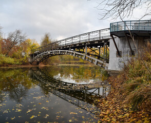 Fototapeta premium bridge over the autumn river, side and bottom view