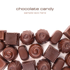 Different chocolate candies over white background
