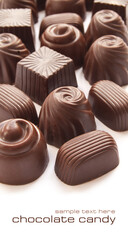 Delicious different chocolate candies over white background