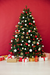 Fototapeta na wymiar Christmas tree with gifts decor garland New Year card
