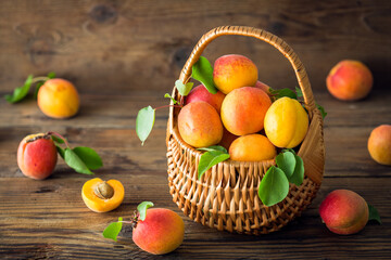 Fresh and ripe organic apricots on the wooden table
