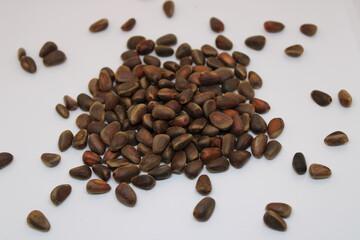 Pine nuts on a white background.