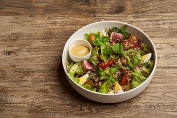 Quinoa salad with boiled egg and fresh vegetables