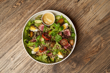 Quinoa salad with boiled egg and fresh vegetables