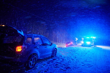 car accident on slippery winter road at night