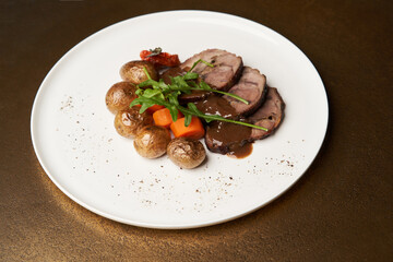 Baked pork and potatoes. Pork meat and vegetables