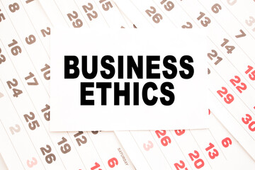 text BUSINESS ETHICS on a sheet from Notepad.a digital background. business concept . business and Finance.