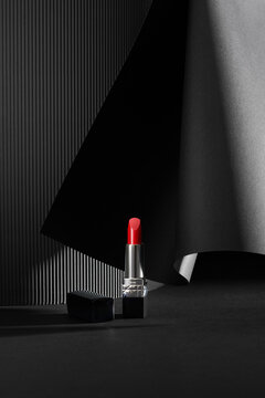 Lipstick. Creative concept of red lipstick on black