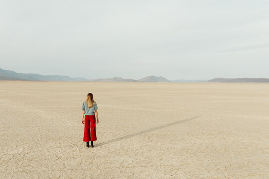 Woman Standing in Desert