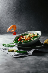 Levitating salad with prawns, avocado and spinach.