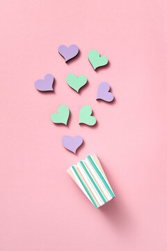 Parer cup with colored hearts.