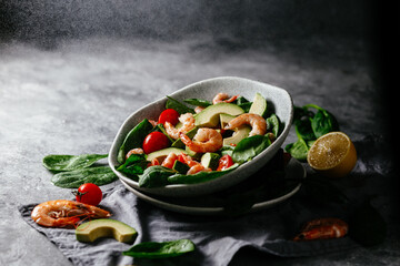 Levitating salad with prawns, avocado and spinach.