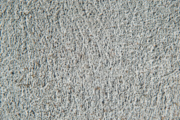Texture of a gray concrete wall in close-up. Construction background.