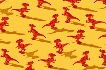 Toy dinosaurs pattern with shadows.