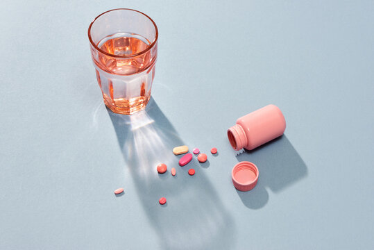 Medicine Or Pill In The Pill Box And A Glass Of Water