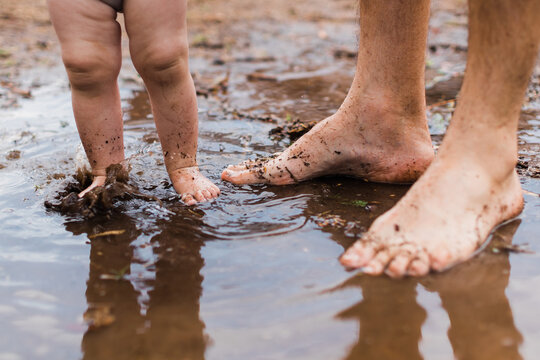 feet splashing in puddle