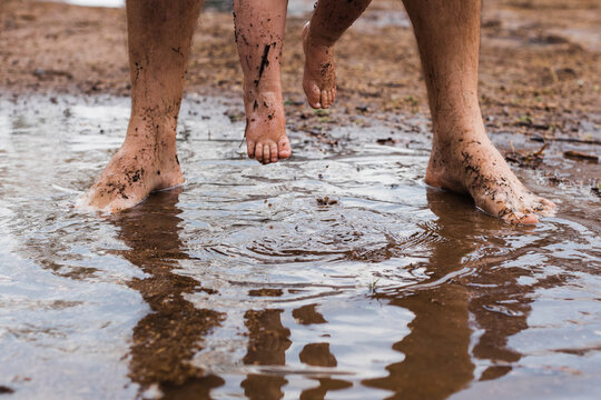 feet splashing in puddle