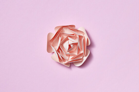 Origami handcraft rose flower from paper.