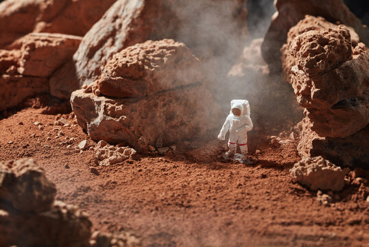 Spaceman on a cocoa planet surface.