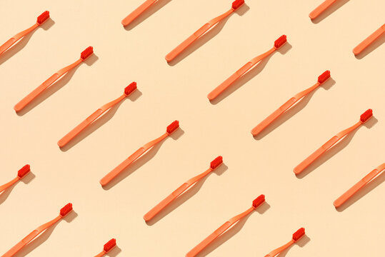 Toothbrushes on yellow background