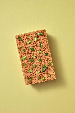Bath sponge with green little leaves.