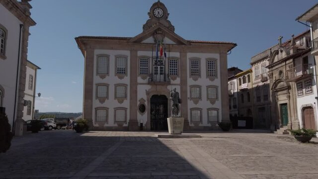 Chaves, Portugal - September 6, 2020:  TILT - Chaves City Hall (Camara Municipal) is perched atop the Camoes Square. Statue erected in honor of Afonso, 8th count of Barcelos and 1st Duke of Braganza.