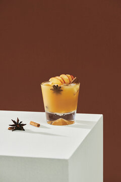 Fruit Alcohol Cocktail With Apple And Cinnamon Stick Isolated On Table