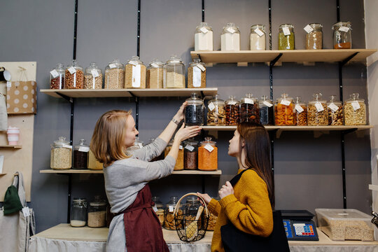 Seller offering buyer product for trial in organic shop