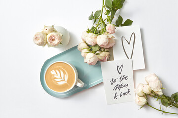 Congratulation card cappuccino cup and roses.