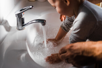 Father washing Childs hands
