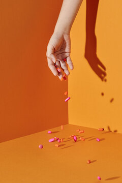 Hand and falling pills