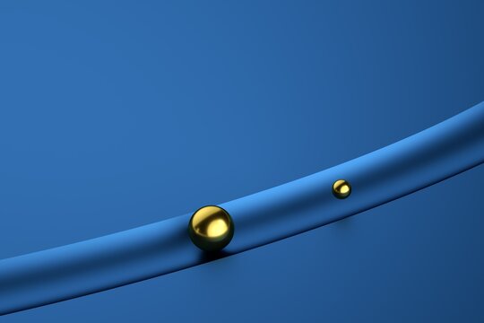 Golden metal balls in the tunnel on blue background