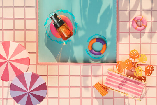 Lotion bottle in miniature swimming pool, paper craft style