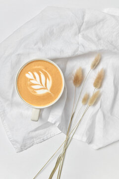 Greeting card - cappuccino and dry grass.
