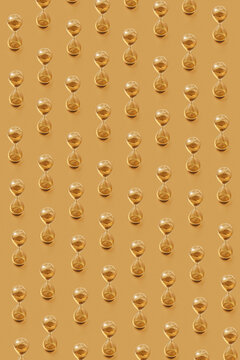 Vertical golden sandglass pattern.