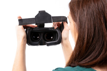 Naklejka premium Young woman in virtual reality (VR) glasses. Isolated on white background